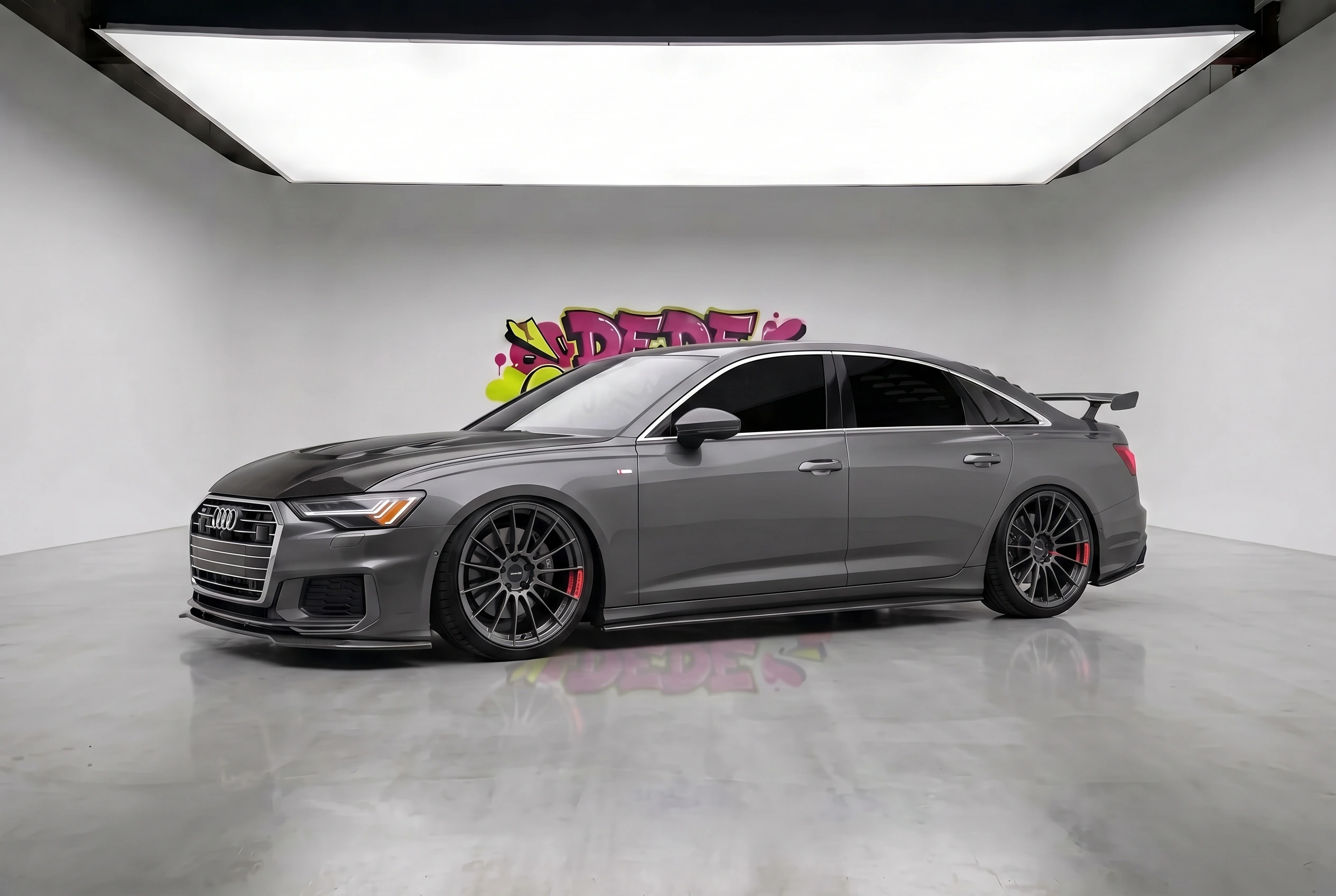 2022 Audi A6 with Enkei RS05RR 18" · Matte Gunmetal, Ride height −100 mm, 100% tint, Custom metallic paint, Scene: Photo studio, Front lip splitter, Side skirts, Rear diffuser, Carbon hood, Rear window louvers, 90s pedestal spoiler